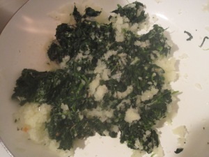 Sauteing the onion and spinach